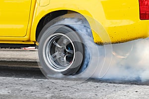 Drag racing car burn tire for the race.