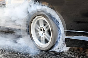 Drag racing car burn tire for the race.