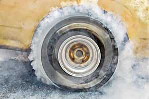 Drag racing car burn tire at start line