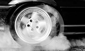 Drag racing car burns rubber