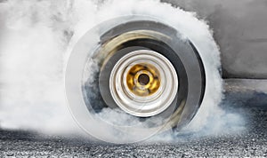Drag racing car burns tires in preparation for the race