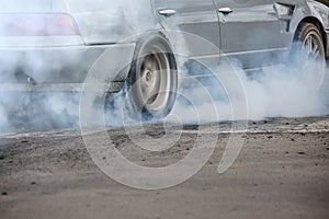 Drag racing car burns tires prepare for the race