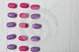 Dragee for refreshment of breath. Different color. Lay in rows