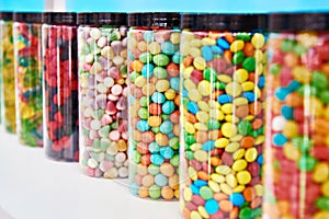 Dragee sweets in icing on store