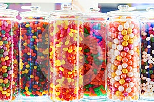 Dragee sweets in icing on store