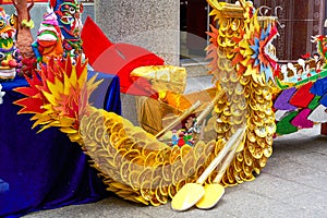 Dragon boat tied with golden paper, characteristic of Guangxi Zhuang, a Chinese minority