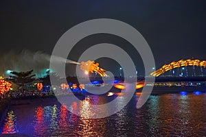 Dragon bridge in Da Nang, Vietnam, at night. The dragon blowing hot fire out of its mouth. A famous attraction in Da Nang