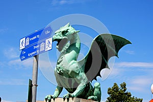 Dragon bridge in a summer day in Ljubljana with turistic signs,