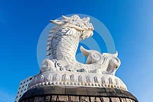 dragon carp statue in danang in vietnam photo