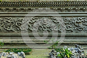 Dragon carving on the wall at the Buddhist Fayu Temple in the Putuoshan mountains, Zhoushan Islands,  a renowned site in Chinese