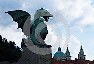 Dragon from the dragon bridge and St. Nicholas cathedaral Ljubljana