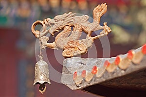 Dragon figure with bell as decoration of Taoist temple, Beijing, China