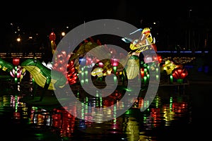 Dragon, frog, fish, and plants lampion in the night time