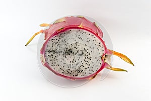 Dragon fruit cut in half on a white background closeup