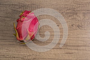 Dragon fruit on old wood background