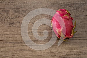 Dragon fruit on old wood background