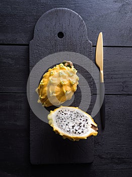 Dragon fruit over a black background