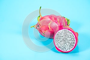 Dragon fruit, Pitahaya, Pitaya exotic asian vegan juicy fruits close up. Over blue background