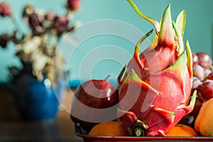 Dragon fruit on a tray of food.