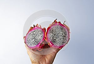 Dragon fruits, Pitaya or Pitahaya on hand in a bright background