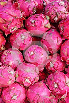 Dragon fruits sold in an Asian street market stall