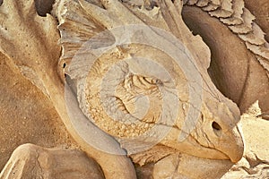 Dragon head as a sculpture in the sand