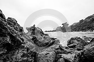 Dragon Head Rock dark or Yongduam of Jeju Island South Korea.