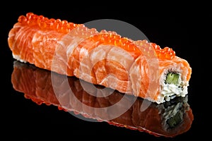 Dragon roll with salmon and red caviar