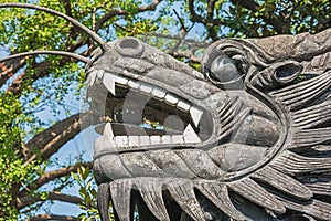 The dragon`s head in the wall separating different parts in the Yuyuan garden
