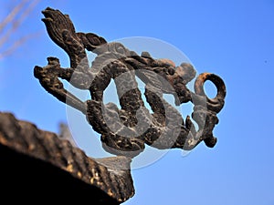 A dragon sculpture on a chinese censer