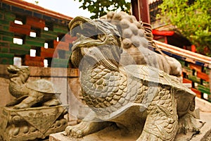 Dragon sons guarding the pavilion at Garden of Peace and Harmony. Beijing, China.