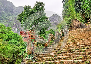 Dragon statue as banister for the stairway of Hang Mua viewpoint near Ninh Binh, Vietnam photo