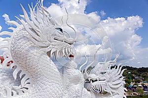 Dragon statue with blue sky and clouds sky at Huay Pla Kang Temple, Chiangrai, Thailand