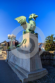 Dragon Statue on the Dragon Bridge Zmajski most in Ljubljana, Slovenia photo