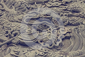 Dragon statue on chinese taoism temple wall