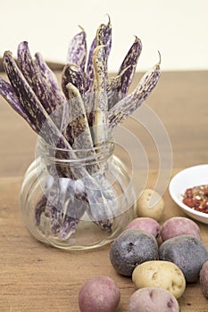 Dragon Tongue Beans bunched in a jar with small mini potatoes an