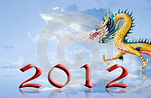 Dragon walking with 2012 year number on the sky