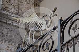 Dragons on the entrance gate of Palazzo civico, Cagliari, Sardinia, Italy photo
