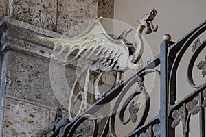 Dragons on the entrance gate of Palazzo civico, Cagliari, Sardinia, Italy