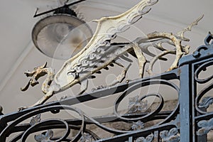 Dragons on the entrance gate of Palazzo civico, Cagliari, Sardinia, Italy