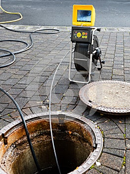 A drain cleaning company checks a blocked drain with a camera before flushing it out