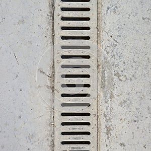 Drain grate in concrete floor