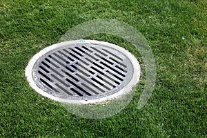 Drain Manhole surrounded by grass