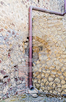 Drain Pipe in Pompeii Wall