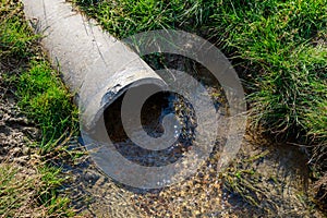 Drain pipe with purified water. Waste runoff. Background with copy space for text