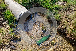 Drain pipe with purified water. Waste runoff. Background with copy space for text