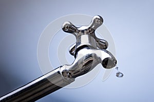Drain water from the Metal tap, Water flowing from modern faucet