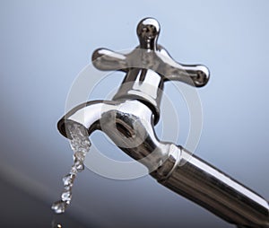 Drain water from the Metal tap, Water flowing from modern faucet