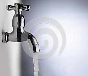 Drain water from the Metal tap, Water flowing from modern faucet
