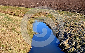 Drainage drainage reclamation channel is an outdated way to lower groundwater levels. dikes of gray stones. supplies water to irri